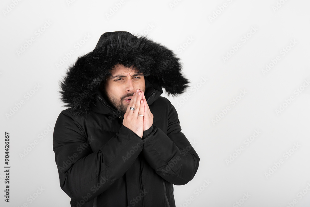Man wearing black coat with very cold expression Man wearing black coat with very cold expression