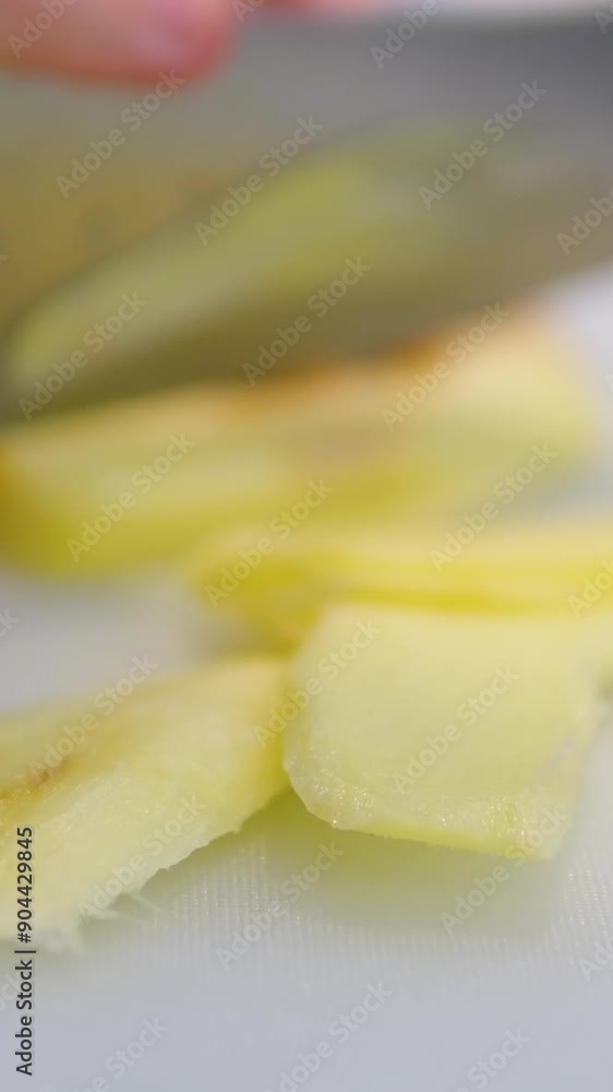 Chop ginger sliced ginger root falls on a wooden surface. Slow motion. Chop ginger sliced ginger root falls on a wooden surface. Slow motion.