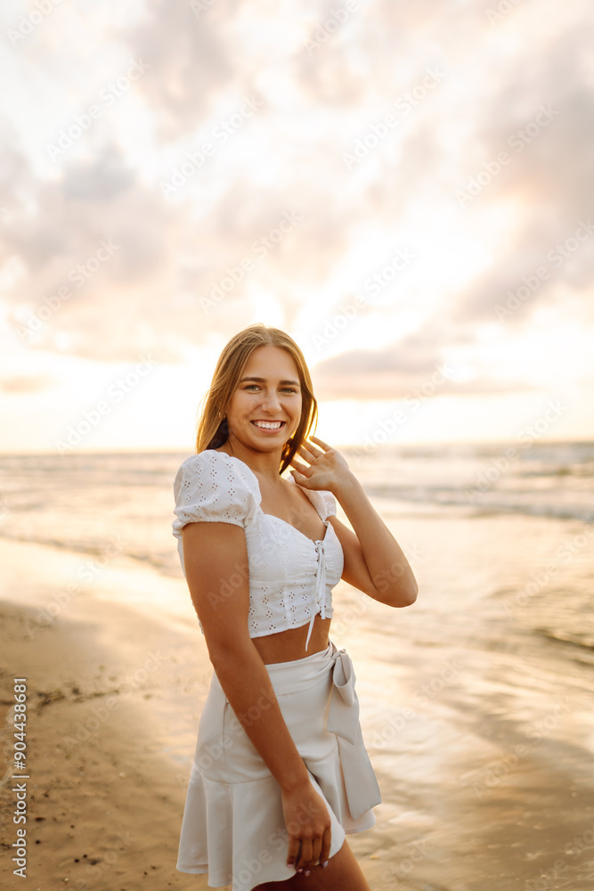 Happy tourist looking at amazing sunset. Seascape at sunset with beautiful sky. Travel, weekend, relax and lifestyle concept. Happy tourist looking at amazing sunset. Seascape at sunset with beautiful sky. Travel, weekend, relax and lifestyle concept.
