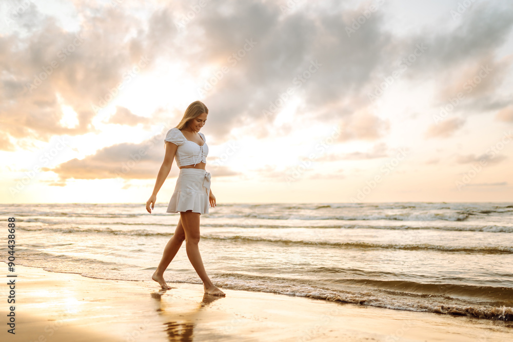 Happy tourist looking at amazing sunset. Seascape at sunset with beautiful sky. Travel, weekend, relax and lifestyle concept. Happy tourist looking at amazing sunset. Seascape at sunset with beautiful sky. Travel, weekend, relax and lifestyle concept.