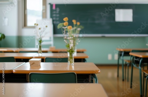 Empty Classroom With Desks and Chalkboard During Daylight