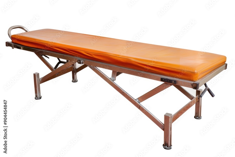 A medical bed with an orange cover used in various healthcare settings, suitable for illustration of patient care and therapy A medical bed with an orange cover used in various healthcare settings, suitable for illustration of patient care and therapy