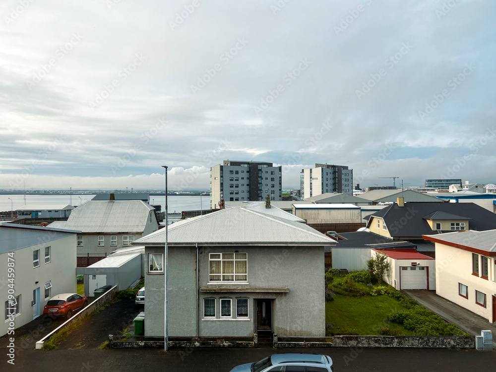 High angle views of residential and hotel buildings in Keflavik, Iceland. Views of the harbor looking out over the North Atlantic Ocean. High angle views of residential and hotel buildings in Keflavik, Iceland. Views of the harbor looking out over the North Atlantic Ocean.
