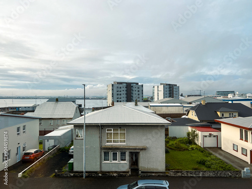 High angle views of residential and hotel buildings in Keflavik, Iceland. Views of the harbor looking out over the North Atlantic Ocean.