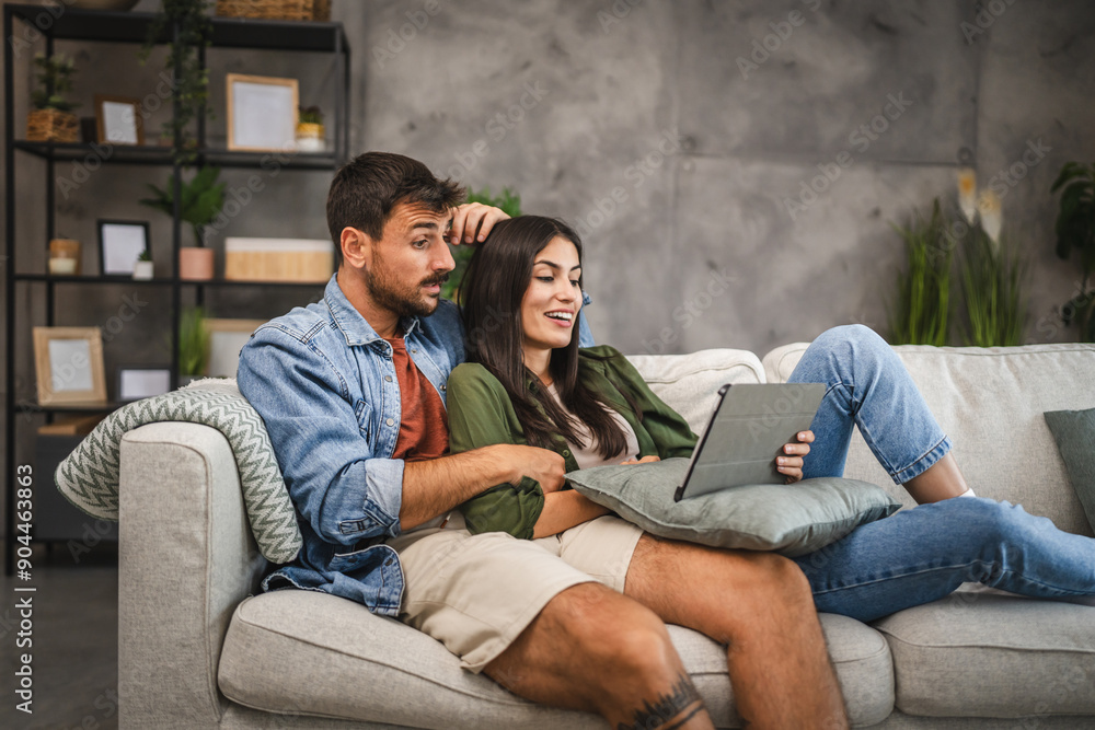 Girlfriend watch movie on tablet with her sleepy boyfriend Girlfriend watch movie on tablet with her sleepy boyfriend