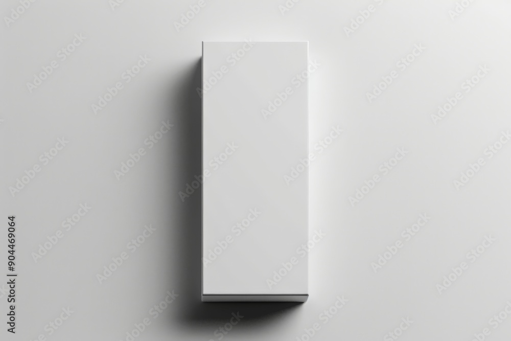 A top view of a rectangular white box with detailed shadow, showcasing its minimalistic design and clean lines, perfect for packaging, storage, or presentation. A top view of a rectangular white box with detailed shadow, showcasing its minimalistic design and clean lines, perfect for packaging, storage, or presentation.