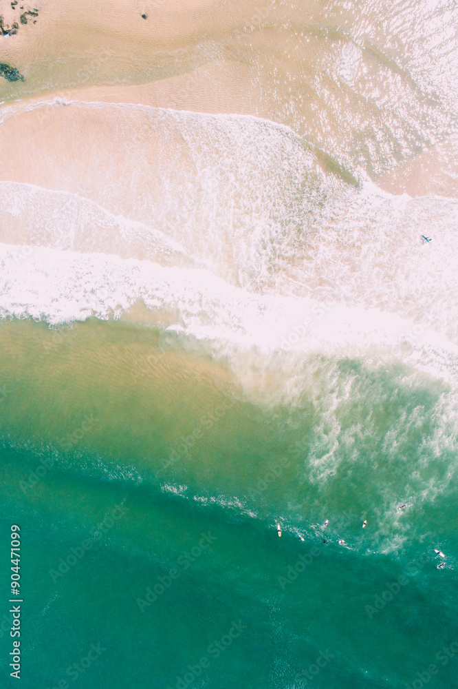 foam from the waves arriving at the shore of the beach aerial view from a drone foam from the waves arriving at the shore of the beach aerial view from a drone