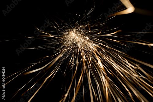 sparks from the grinder glowing in the dark