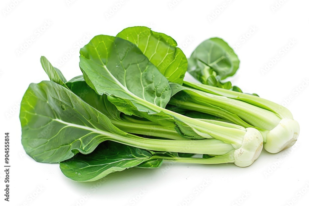 Fresh green vegetables arranged on a clean white surface, ideal for food photography and advertising Fresh green vegetables arranged on a clean white surface, ideal for food photography and advertising
