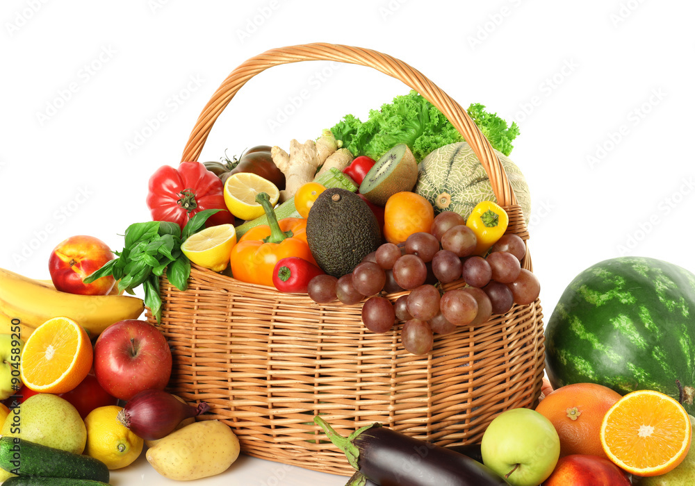 Many different fruits and vegetables in wicker basket isolated on white Many different fruits and vegetables in wicker basket isolated on white