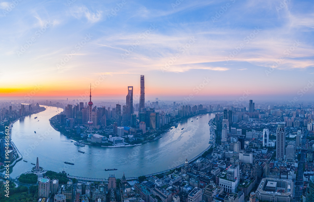 Obraz premium Aerial view of modern city skyline and buildings at sunrise in Shanghai.