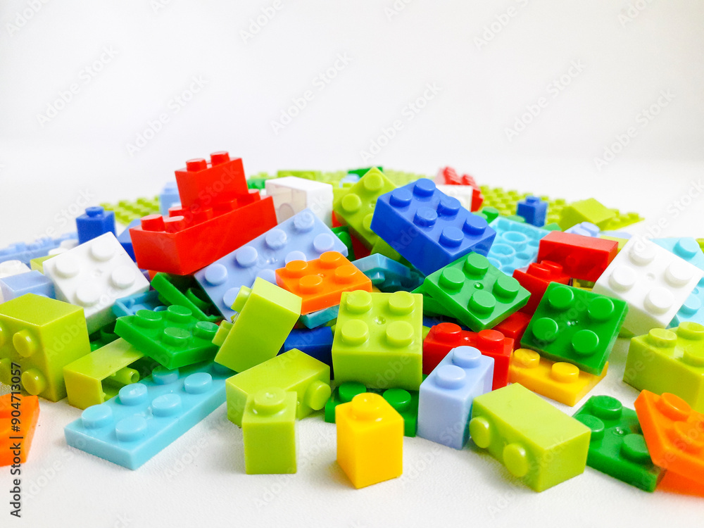 Various colored toy blocks on a white background. Educational toys for children Various colored toy blocks on a white background. Educational toys for children
