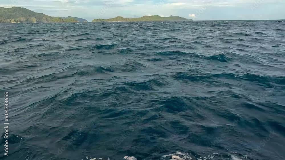 Seascape from moving boat on a sunny day. Vacation, travel, and holiday concept. Seascape from moving boat on a sunny day. Vacation, travel, and holiday concept.