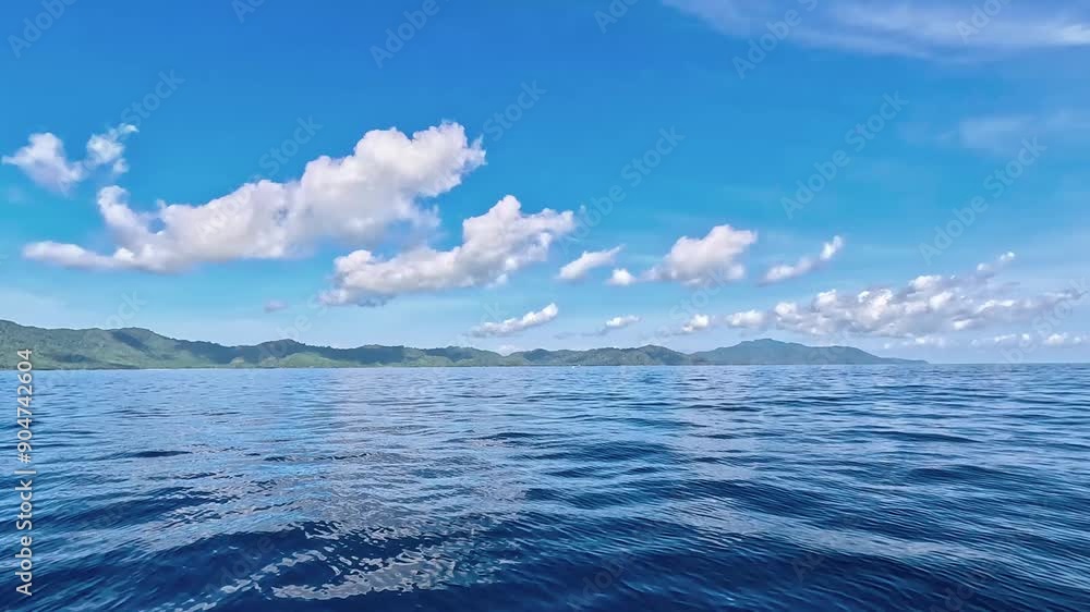 Seascape from moving boat on a sunny day. Beautiful skyscape. Vacation, travel, and holiday concept. Seascape from moving boat on a sunny day. Beautiful skyscape. Vacation, travel, and holiday concept.