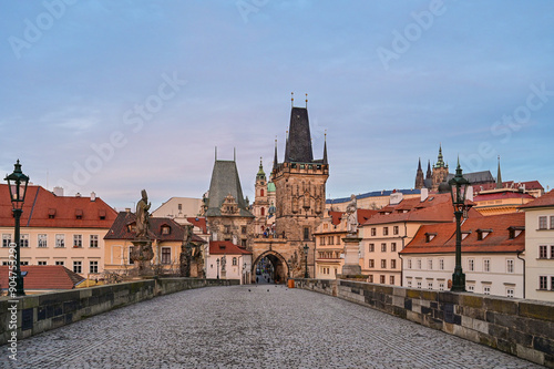 Prague's Lesser Town Bridge Tower Malostranska mostecka vez at the famous Charles Bridge at sunrise in the early morning with a beautiful sky, Prague, Czech Republic