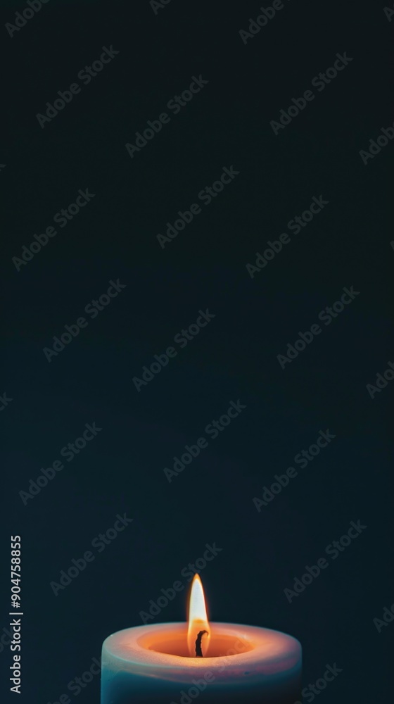 Fototapeta premium Illuminated candle in darkness