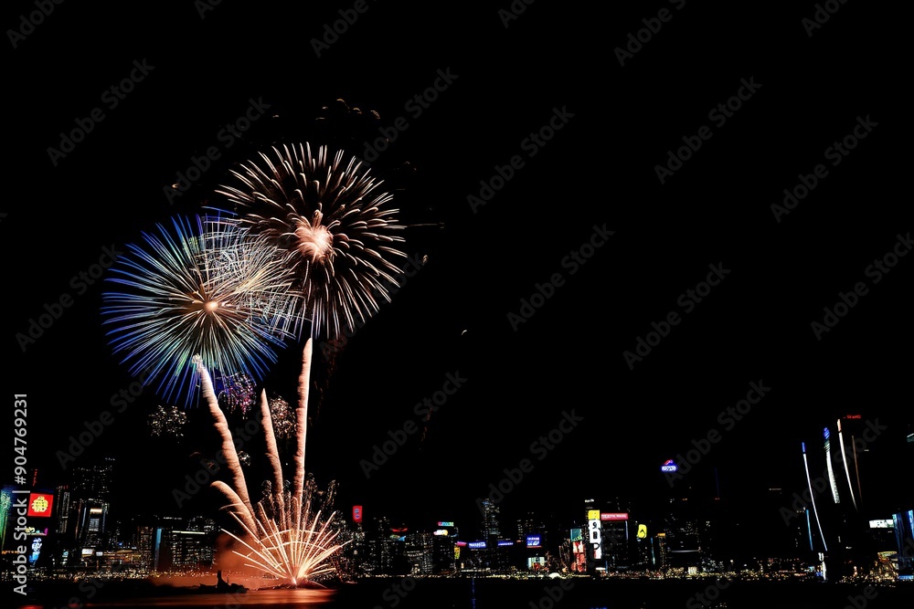 Many flashing fireworks with night cityscape background Many flashing fireworks with night cityscape background