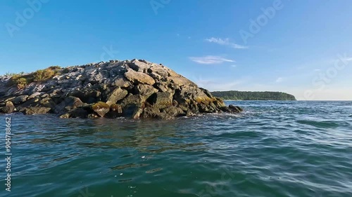 Seascape from moving boat on a sunny day. Vacation, travel, and holiday concept.
