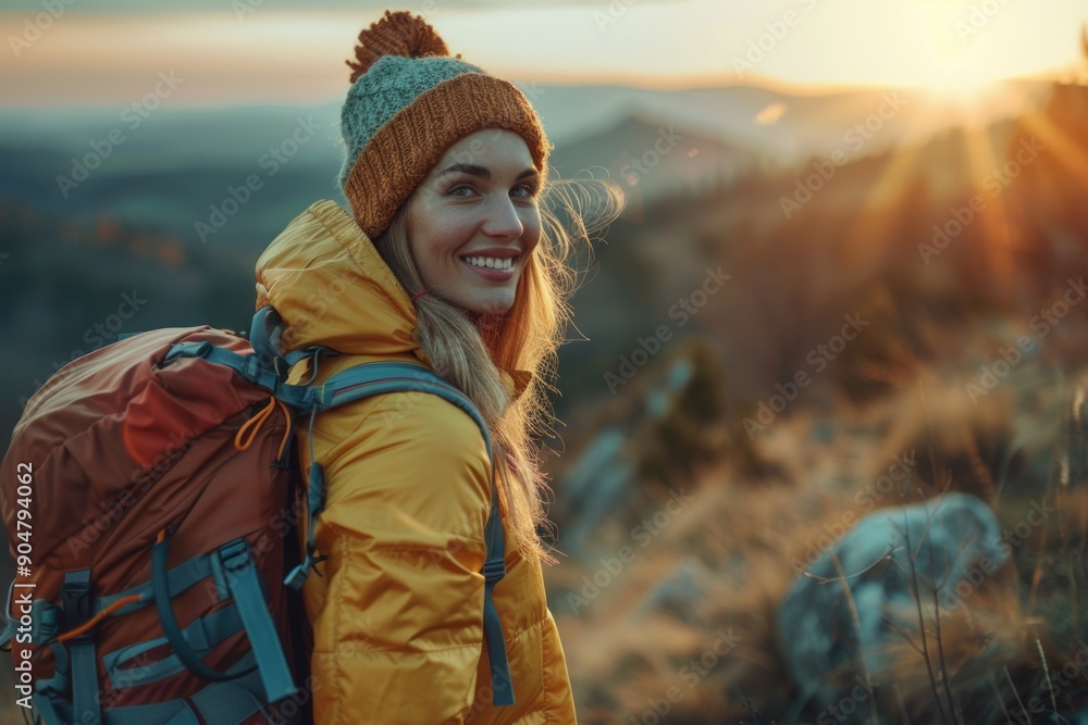 Woman hiking with backpack at sunset in mountains Woman hiking with backpack at sunset in mountains