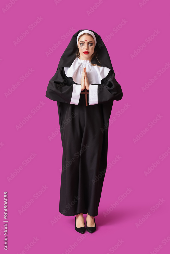 Young woman dressed for Halloween as nun on color background Young woman dressed for Halloween as nun on color background