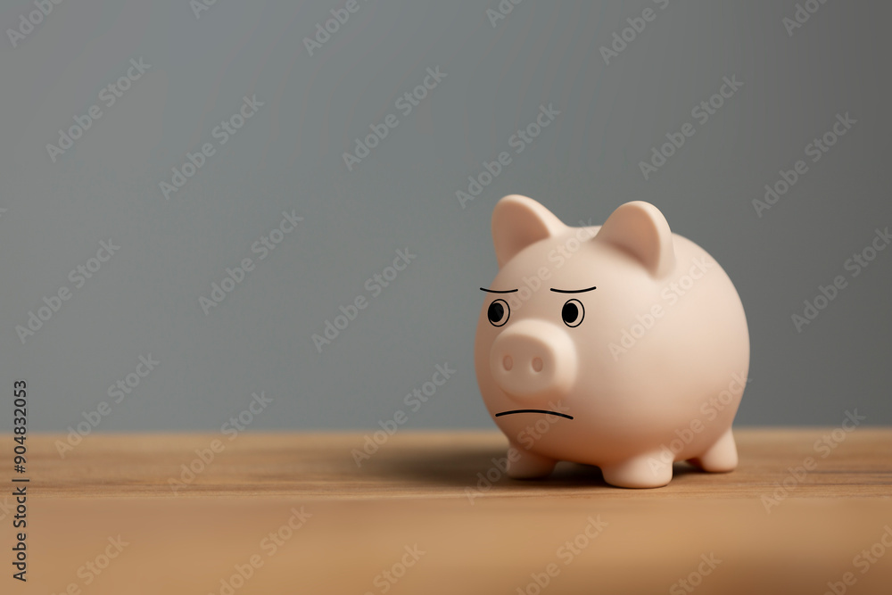 Growth trends and savings planning Investment planning. Sad piggy bank on desk Growth trends and savings planning Investment planning. Sad piggy bank on desk