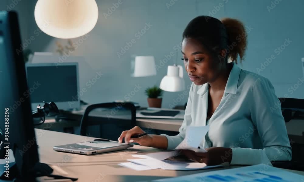 Woman employee and reading on computer in office on browsing internet online and research for ideas. Female person workplace and desk with deadline or overtime Woman employee and reading on computer in office on browsing internet online and research for ideas. Female person workplace and desk with deadline or overtime
