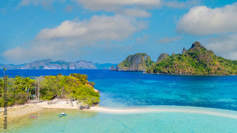 Aerail view of tropical exotic island sand bar separating sea in two with turquoise in El Nido, Palawan, Philippines. Aerail view of tropical exotic island sand bar separating sea in two with turquoise in El Nido, Palawan, Philippines.
