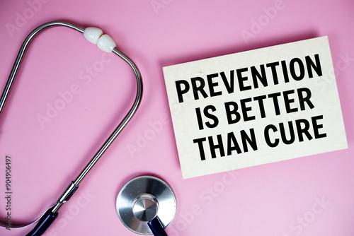 Foto Prevention is better than cure text with stethoscope on pink background, Healthy