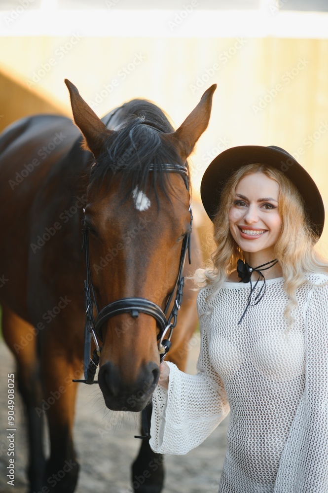 Obraz premium young woman in a dress with a horse