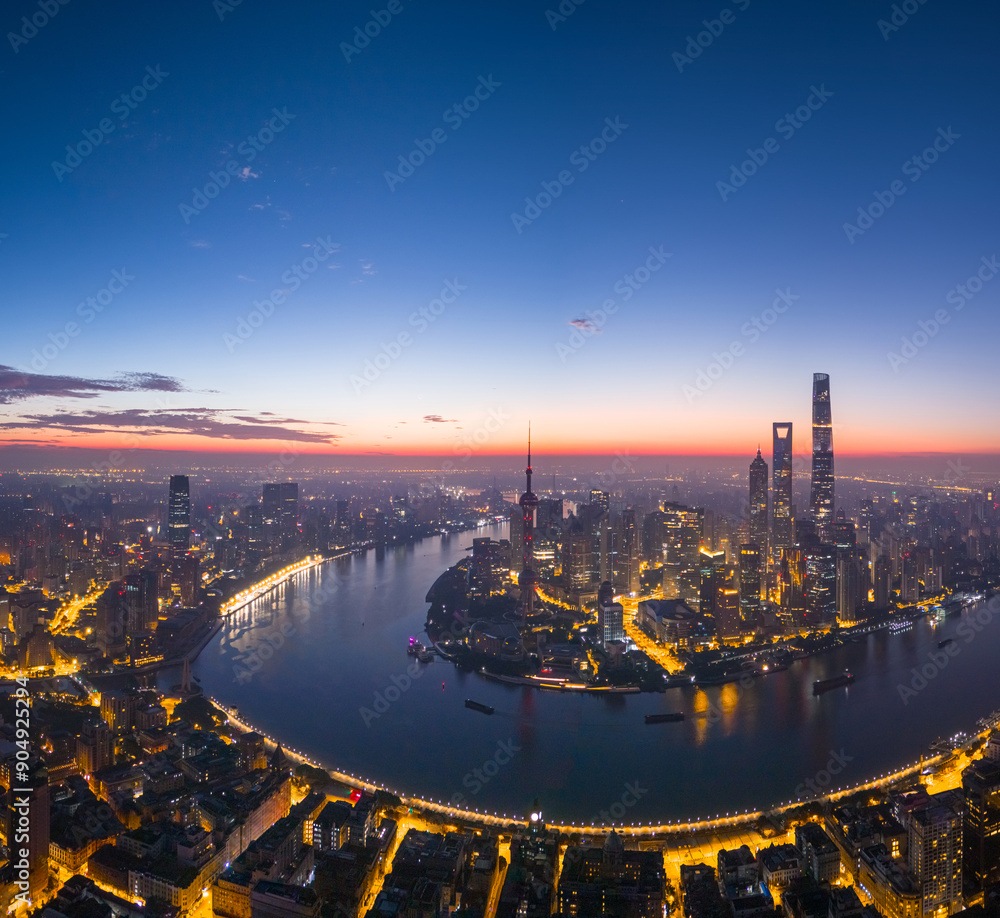 Obraz premium Aerial view of modern city skyline and buildings at sunrise in Shanghai.