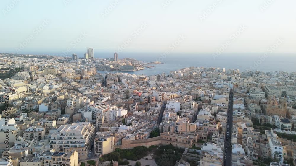 Cinematic flight over Sliema, Malta at sunrise Cinematic flight over Sliema, Malta at sunrise