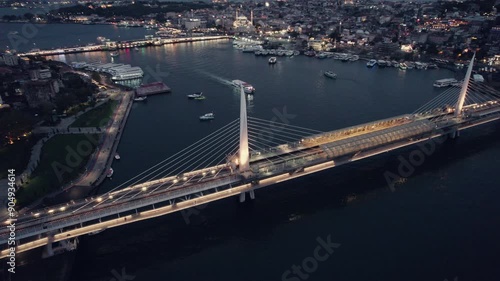 Blue hour night shot on the bosphorous showing the golden horn bridge and the main river of Istanbul, copy space and slow motion photo