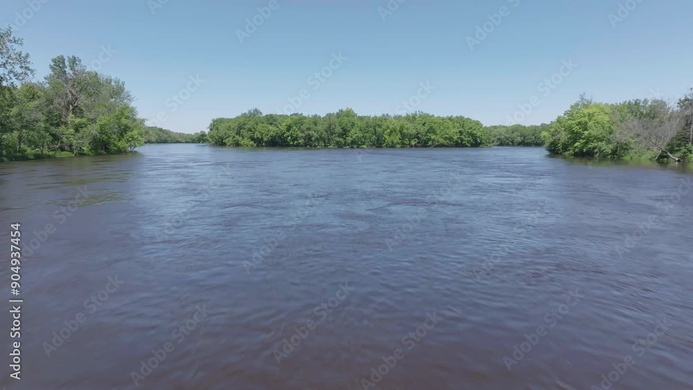 Low angle moving shot of water surface of Mississippi river and tropical forest near it in Minnesota, USA. Aerial view. Low angle moving shot of water surface of Mississippi river and tropical forest near it in Minnesota, USA. Aerial view.