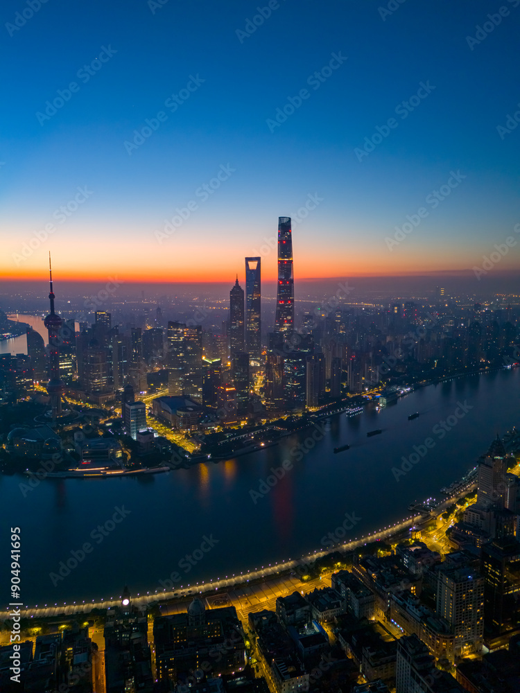 Fototapeta premium Aerial view of shanghai skyline and huangpu river at sunrise