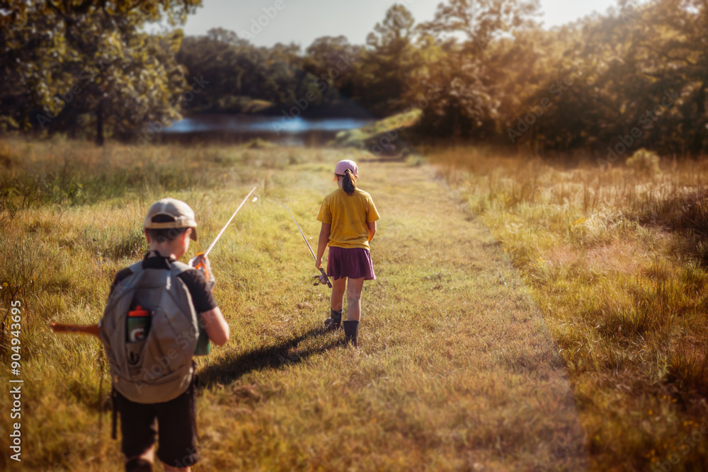 Children going fishing in morning light Children going fishing in morning light