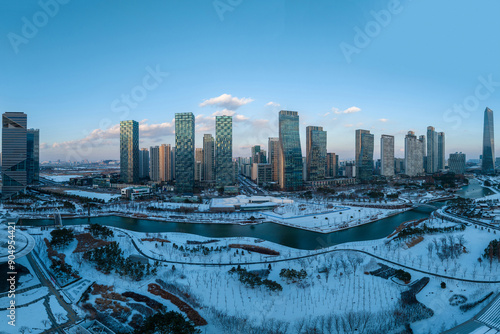 Songdo-dong, Yeonsu-gu, Incheon, South Korea - December 17, 2022: Aerial and winter view of Songdo Central Park with canal and apartments at Songdo New Town
 photo