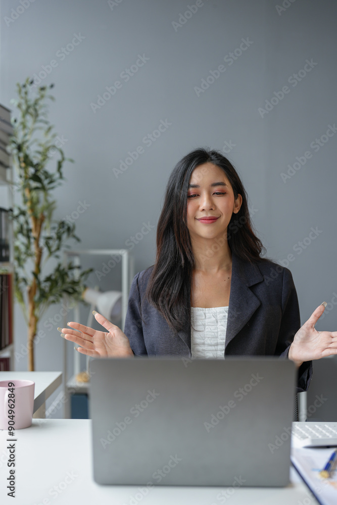 Asian businesswoman sitting and working with laptop computer Use the phone to talk via video call. online in financial business Business ideas to start online through the media. Asian businesswoman sitting and working with laptop computer Use the phone to talk via video call. online in financial business Business ideas to start online through the media.