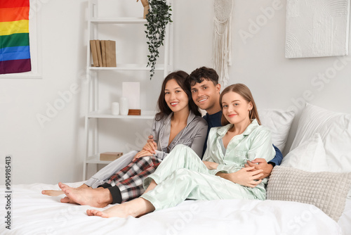 Happy young polyamorous cou...