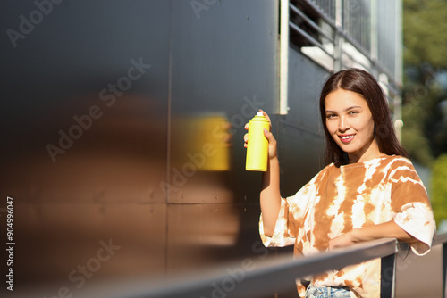 Young Asian woman with spra...