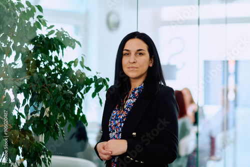 Portrait of a Confident Businesswoman with Crossed Arms in Her Office Environment. photo