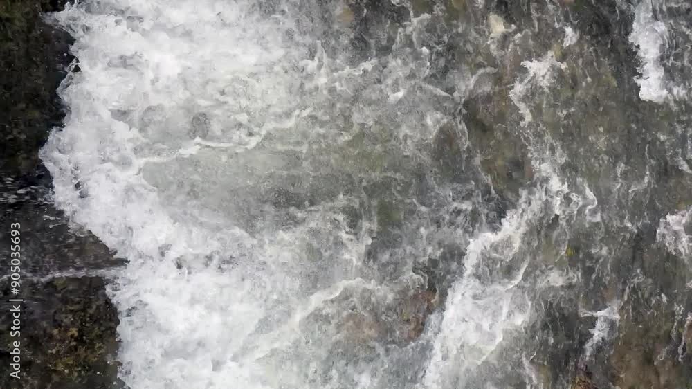 water flowing close up, waves of water, water with a lot of white foam and bubbles. The water appears to be very choppy and rough, A waterway with a large amount of water flowing through it water flowing close up, waves of water, water with a lot of white foam and bubbles. The water appears to be very choppy and rough, A waterway with a large amount of water flowing through it