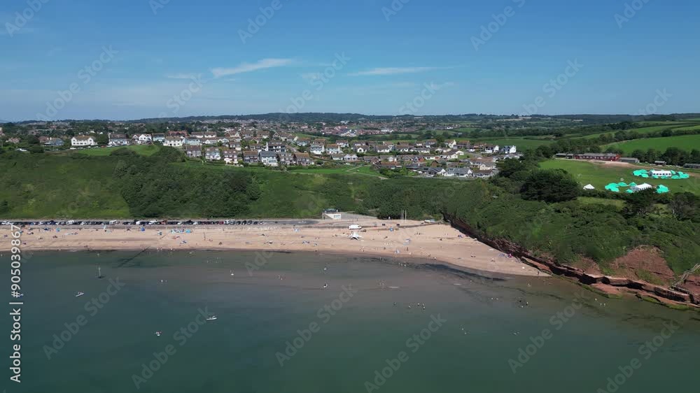 Exmouth, East Devon, England: DRONE VIEWS: Exmouth beach close to the start of the Jurassic Coast. Exmouth is a popular UK holiday destination and a magnet for water sports enthusiasts (Clip 1). Exmouth, East Devon, England: DRONE VIEWS: Exmouth beach close to the start of the Jurassic Coast. Exmouth is a popular UK holiday destination and a magnet for water sports enthusiasts (Clip 1).