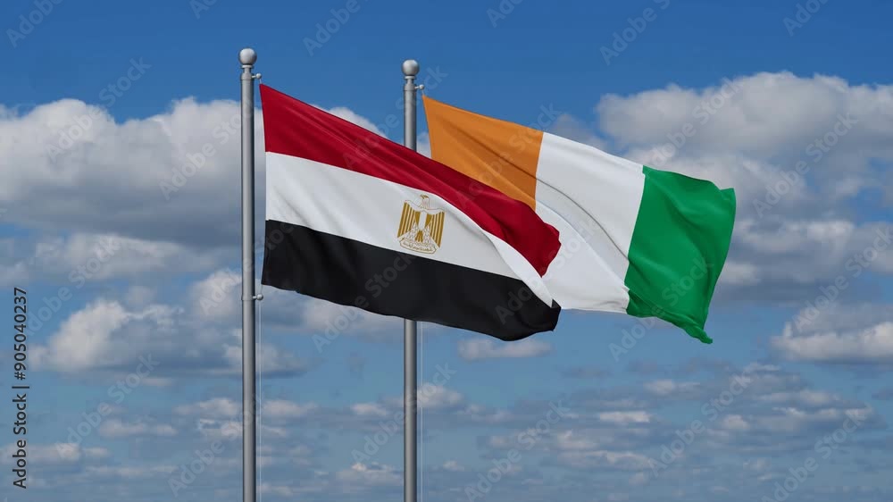 Ivory Coast or Cote d'Ivoire and Egypt flags flying together, video concept of the relationship, two country cooperation concept Ivory Coast or Cote d'Ivoire and Egypt flags flying together, video concept of the relationship, two country cooperation concept