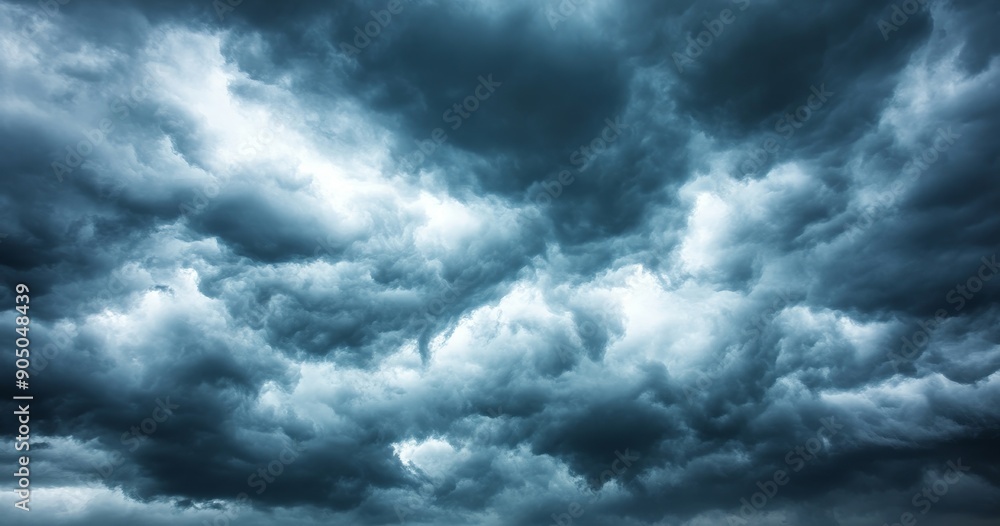There is a dark sky with stormy clouds before a thunderstorm. There is a dramatic sky with rain. There is a dark sky with stormy clouds before a thunderstorm. There is a dramatic sky with rain.