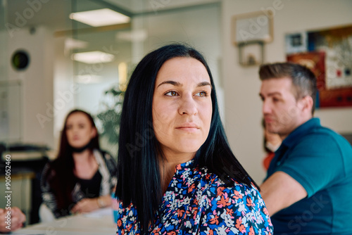 Professional Businesswoman Leading Engaging Meeting with Colleagues: A Headshot Portrait. photo