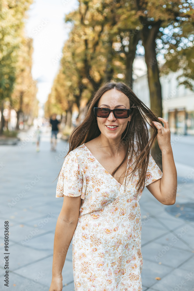 Portrait of a smiling happy woman in sunglasses on a summer day Portrait of a smiling happy woman in sunglasses on a summer day