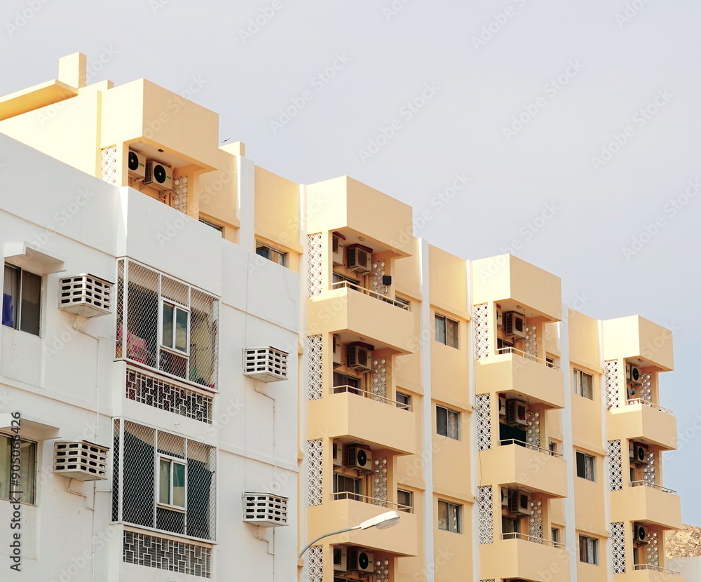 Urban Apartment Building Facade Close-Up Pastel Yellow Urban Apartment Building Facade Close-Up Pastel Yellow