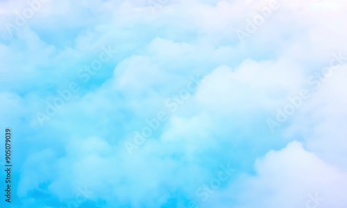 Serene Blue Sky with Fluffy Clouds: Perfect Background for Calming and Relaxative Visual Content photo