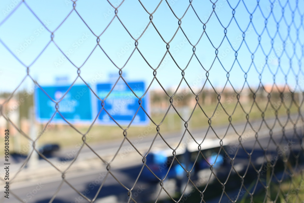 a fence with blurred background in the city of Madrid a fence with blurred background in the city of Madrid