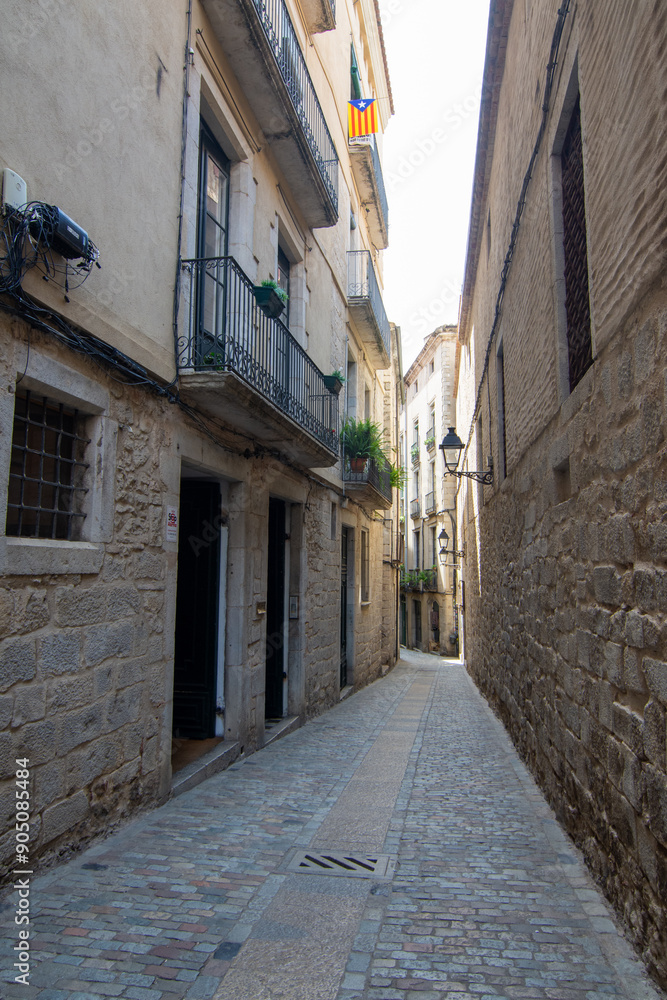 Stone alleyway in Girona's historic center Stone alleyway in Girona's historic center